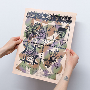 SUM newspaper artist publication being held up by a persons hands